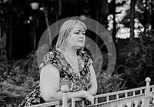 Blonde hair plus size woman portrait  smoking at city