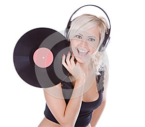 Blonde in headphones with vinyl record