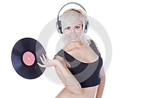 Blonde in headphones with vinyl record
