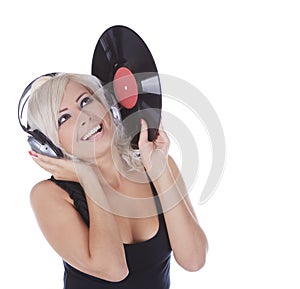 Blonde in headphones with vinyl record