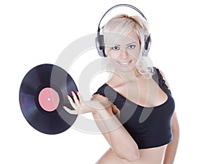 Blonde in headphones with vinyl record over white