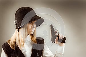 Blonde holding a gun