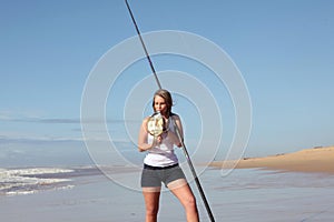 Blonde lady kissing a fish she caught