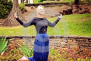 Blonde lady praying and worshipping