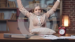 Blonde lady stretching arms and yawning after short sleep