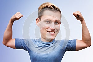 Blonde man with big head flexing his muscles