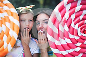 Blonde Mum With Her Daughter Surprised, Holds Big Chupa Chups