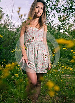 Blonde posing in summer dress