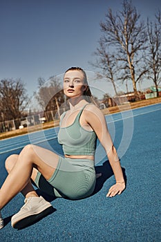 blonde and sporty woman in activewear