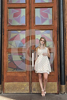 Blonde in a summer white dress