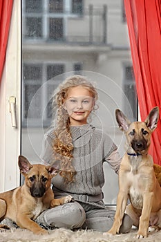 Blonde with two puppies mongrels