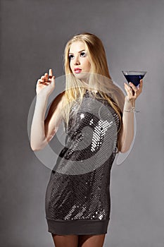 Blonde woman with blue cocktail