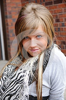 Blonde woman with blue eyes without make up, natural flawless skin