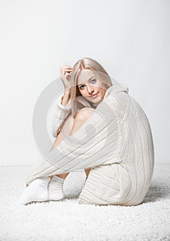 Blonde woman in cashmere sweater