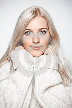 Blonde woman in cashmere sweater