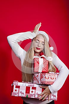 Blonde woman with christmas jelly bag hat forgot something
