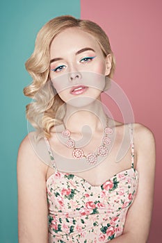 Blonde woman with color makup on colorful background
