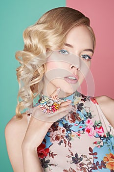 Blonde woman with color makup on colorful background