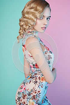 Blonde woman with color makup on colorful background