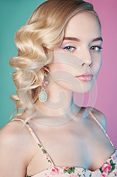 Blonde woman with color makup on colorful background