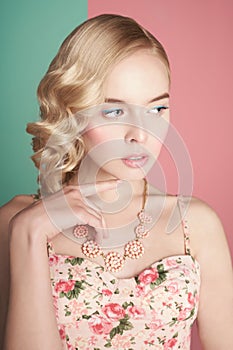 Blonde woman with color makup on colorful background