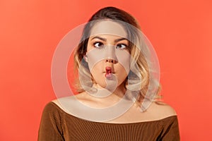 Blonde woman with crossed eyes and fish lips
