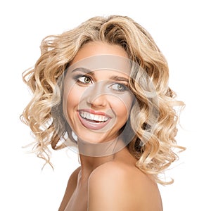 Blonde woman with curly beautiful hair smiling photo