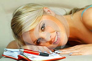 Blonde woman with datebook