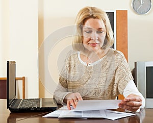 Blonde woman with documents