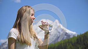 Blonde Woman Drinking Alpine Water