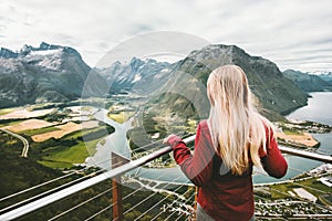 Blonde woman enjoying mountains landscape
