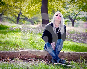 Blonde woman enjoying the spring nature outdoors