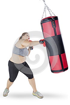 Blonde woman exercises boxing