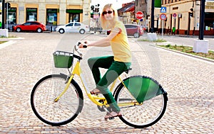Blonde Woman With Glasses on Bicycle