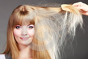 Blonde woman with her long healthy hair.