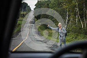 Blonde Woman Hitchhiking