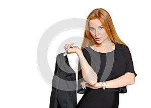 blonde woman holding a dark jacket