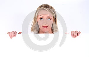 Blonde Woman Holding Sign with Sad Expression