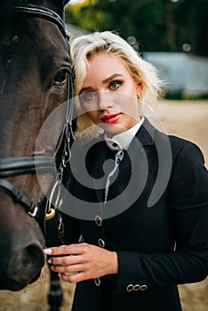 Blonde woman with horse, horseback riding