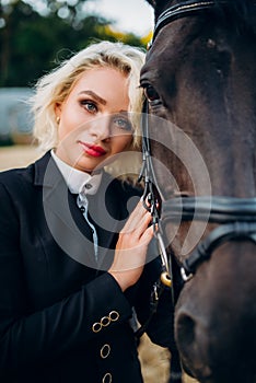 Blonde woman with horse, horseback riding