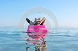 Blonde woman with inflatable raft