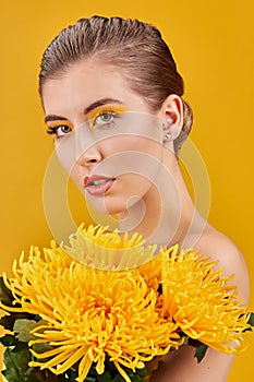 Blonde woman with yellow flowers