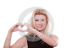 Blonde woman making heart symbol with hands