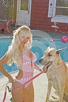 Blonde Woman Poolside with a Great Dane