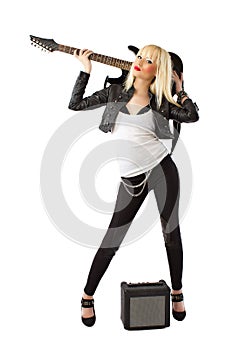 Blonde woman in posing with electric guitar