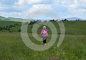 Blonde Woman Running on Meadow