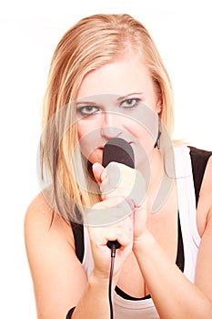 Blonde woman singing to microphone