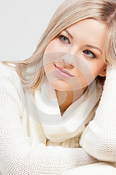 Blonde woman sitting on sofa