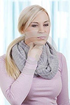 Blonde woman with sore throat photo