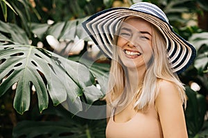 Blonde woman in sun hat